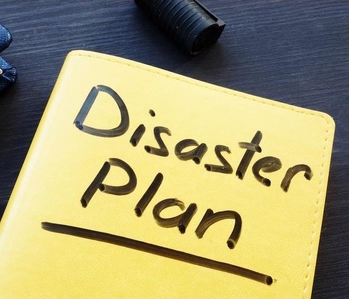 file folder with disaster plan written on it
