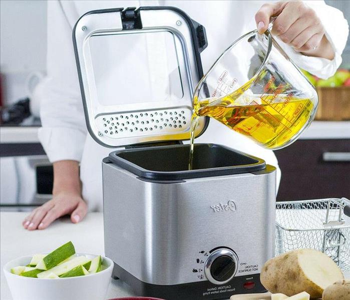 deep fryer on counter with food